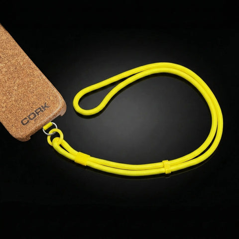 Cordón amarillo flúor junto a una funda de corcho CorkProtech